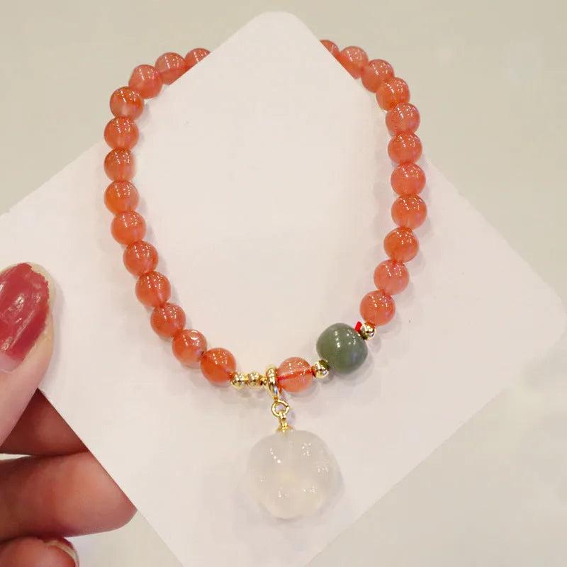 Red agate women's bracelet with cat's paw charm and jade inlay on 6mm band