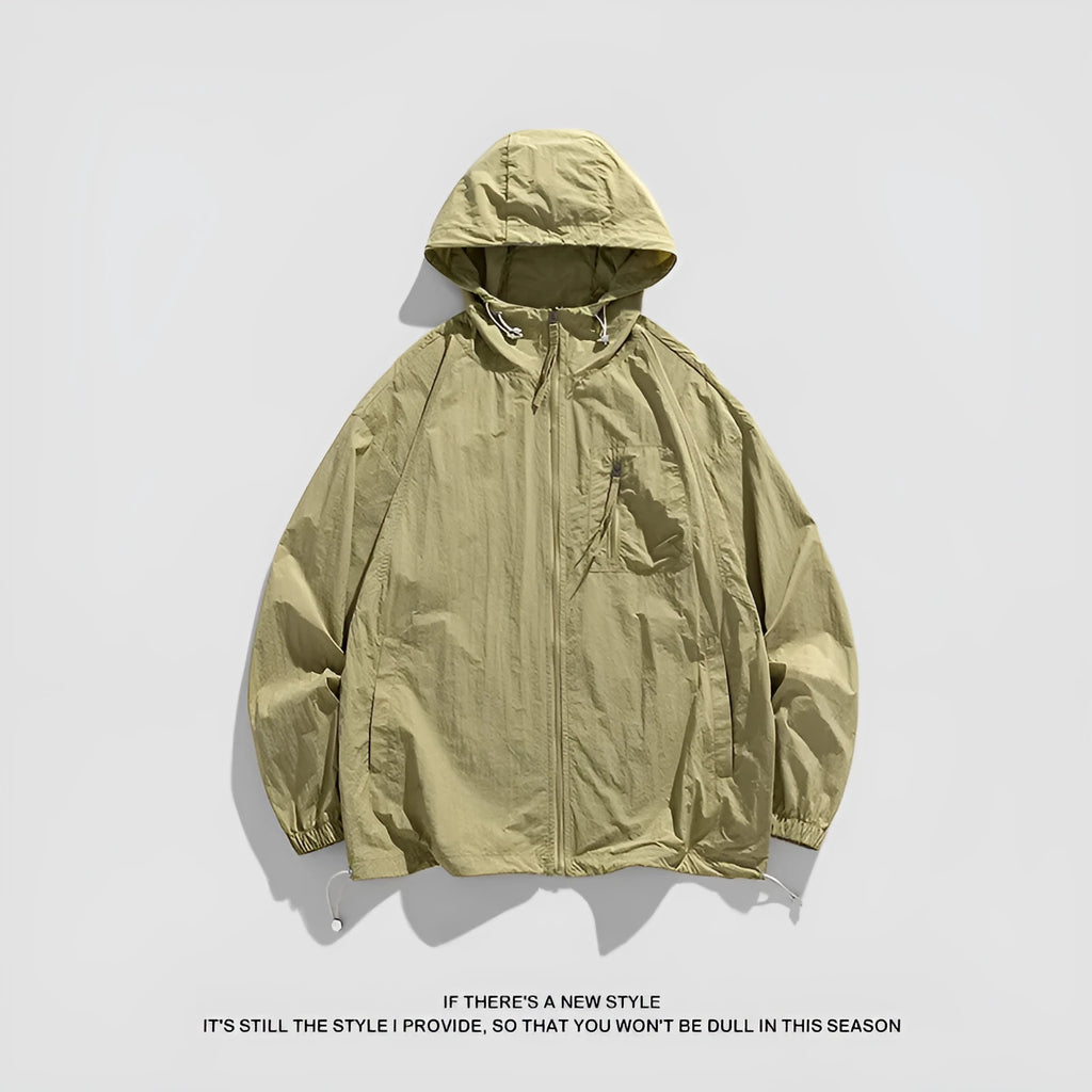 Lightweight beige hooded spandex sun protection jacket for men and women on a hanger.