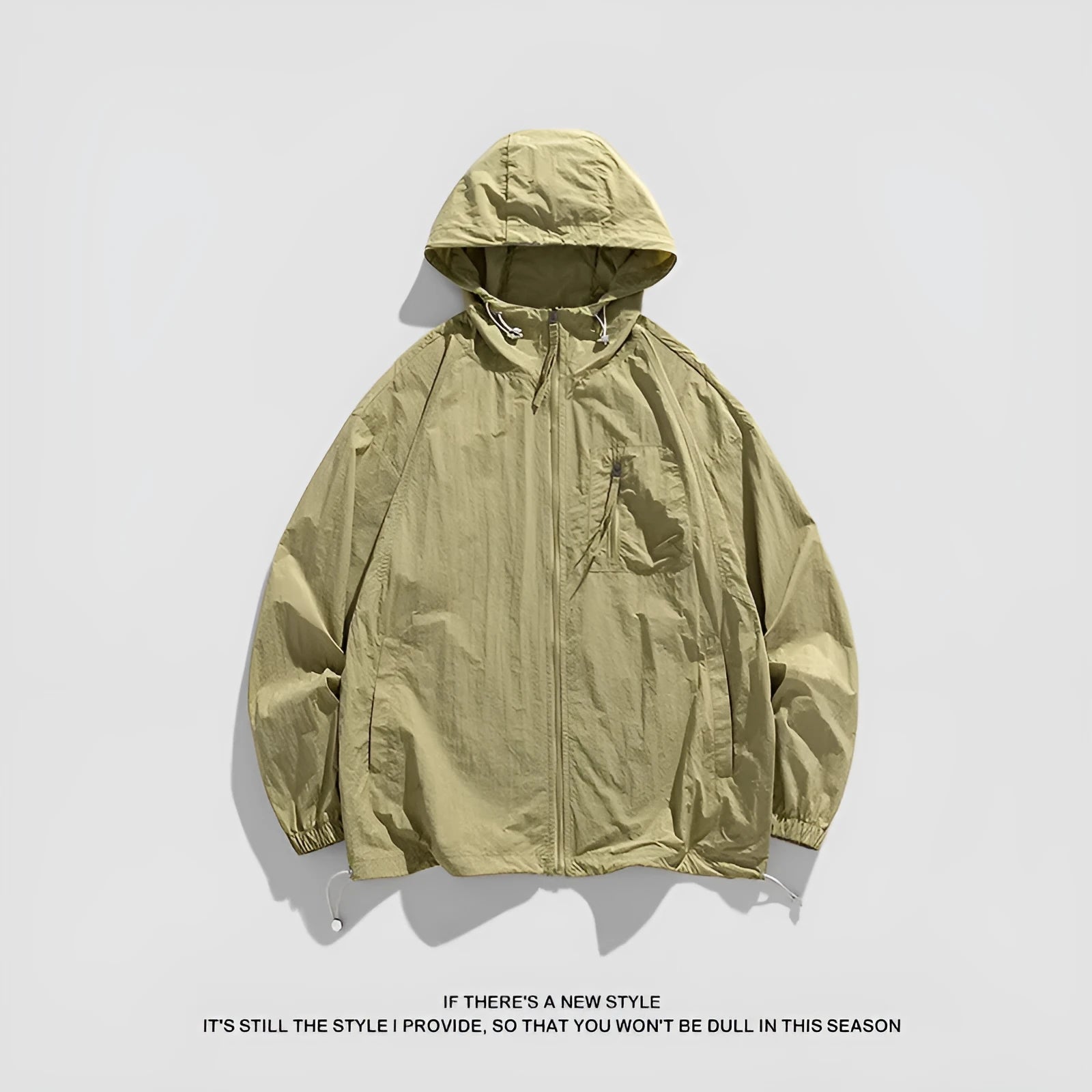 Lightweight beige hooded spandex sun protection jacket for men and women on a hanger.