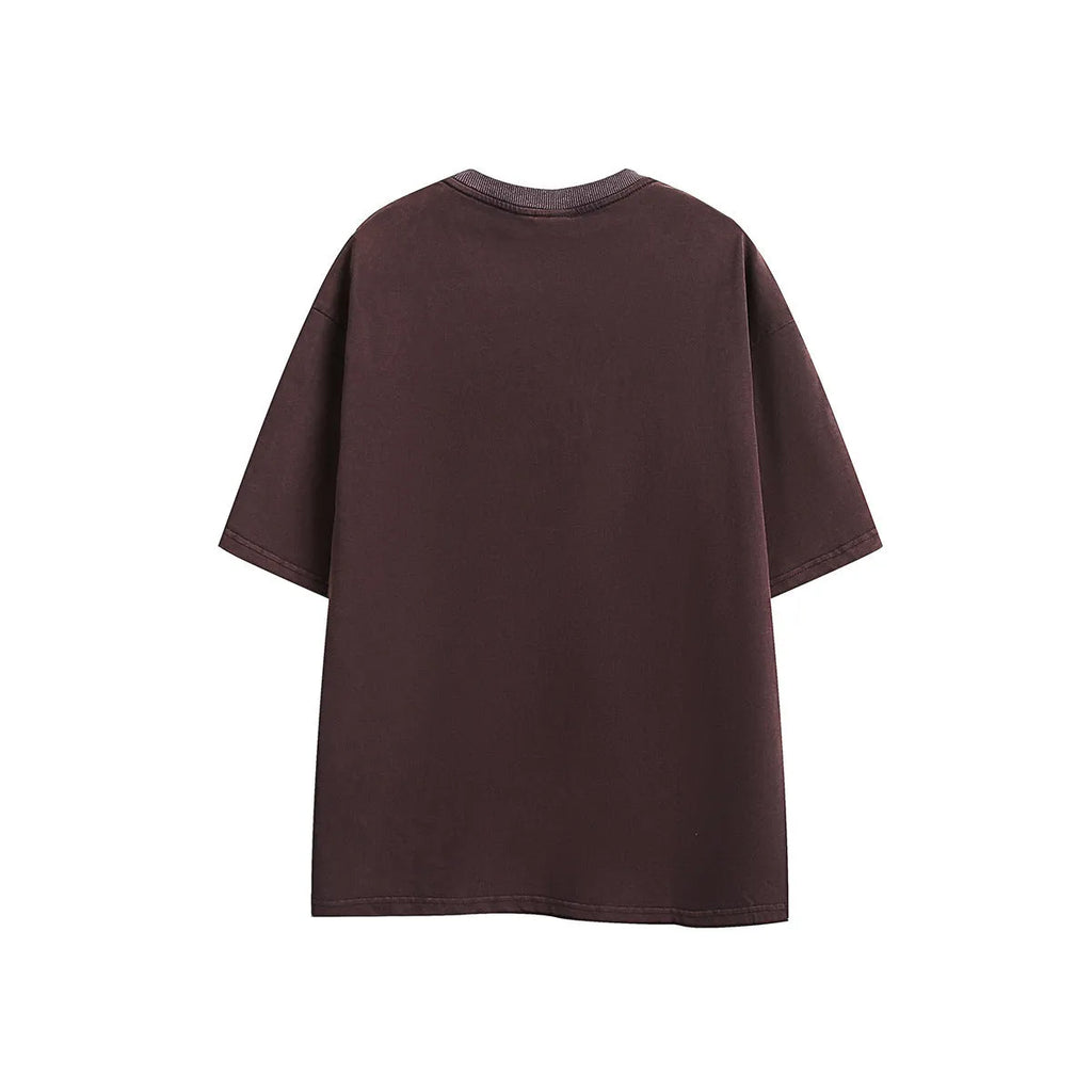 Black and purple loose-fit cotton T-shirt with embroidered design on the front.