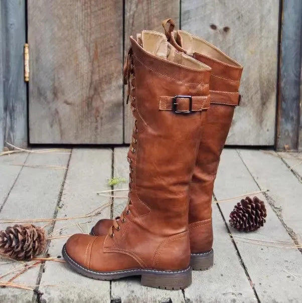Women's black chunky heel high leg boots with a round toe and pull-on design.