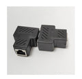 White RJ45 three-way tee network cable splitter adapter on a table.