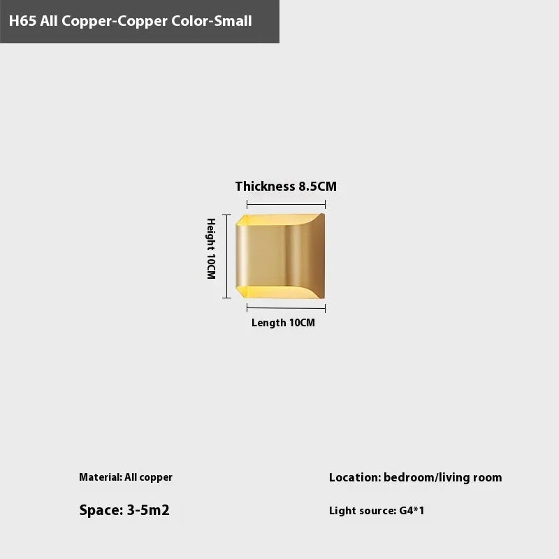 Minimalist copper wall lamp with black gold finish mounted beside bed