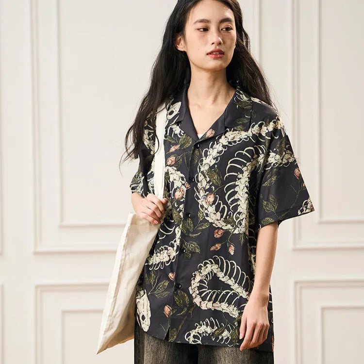 Short sleeve Cuban collar shirt with snake bone and floral pattern in a colour block style.
