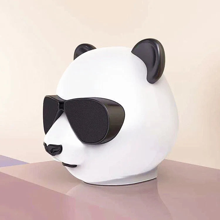 Classic style portable mini Bluetooth speaker on a surface, showing its compact design.