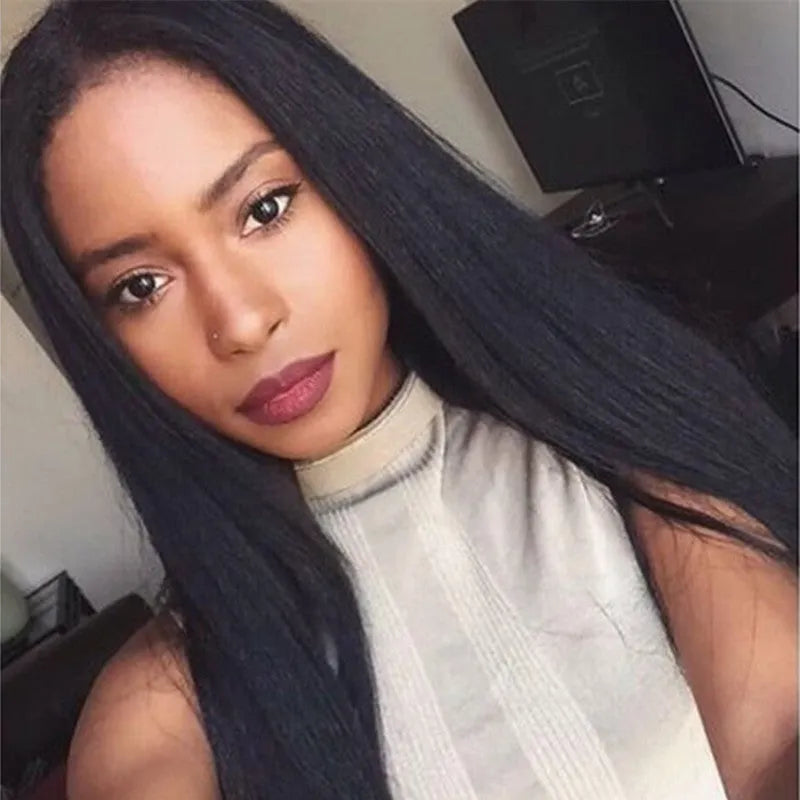 Long straight black synthetic wig with centre-parted fringe on a model