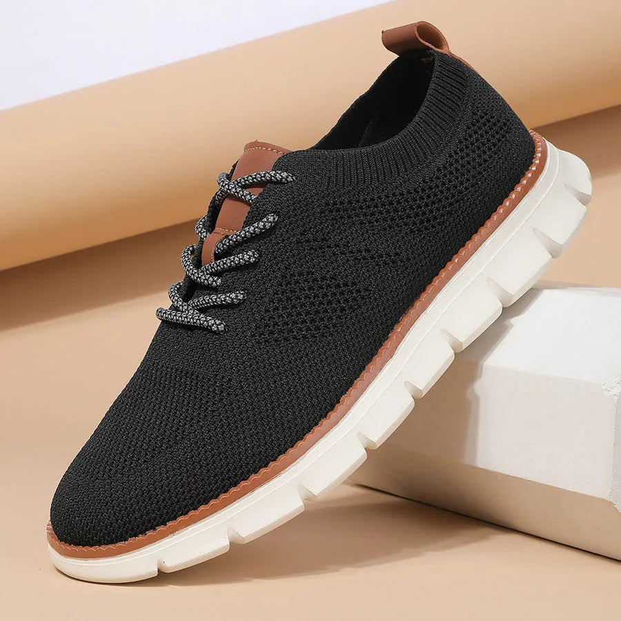 Men's grey and black mesh fabric casual sneakers with low heel and round toe.