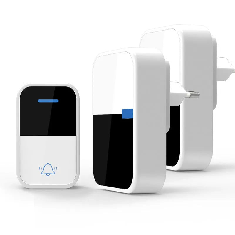 Modern white wireless doorbell kit with plug-in receiver and self-powered push button on a wooden door frame.