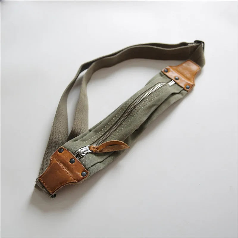 Green American retro military style chest bag with washed canvas and cowhide leather details