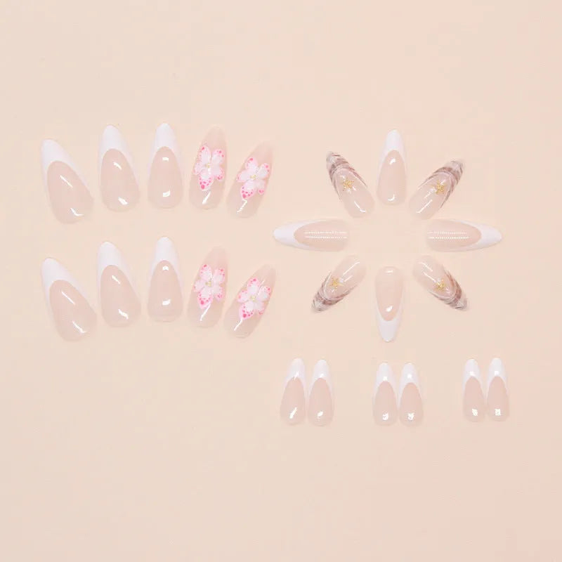 French style artificial false nails with a grey rock pattern and white flower patch design on a plastic card.