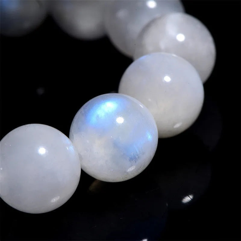 Natural blue moonlight round bead moonstone bracelet on a white background.