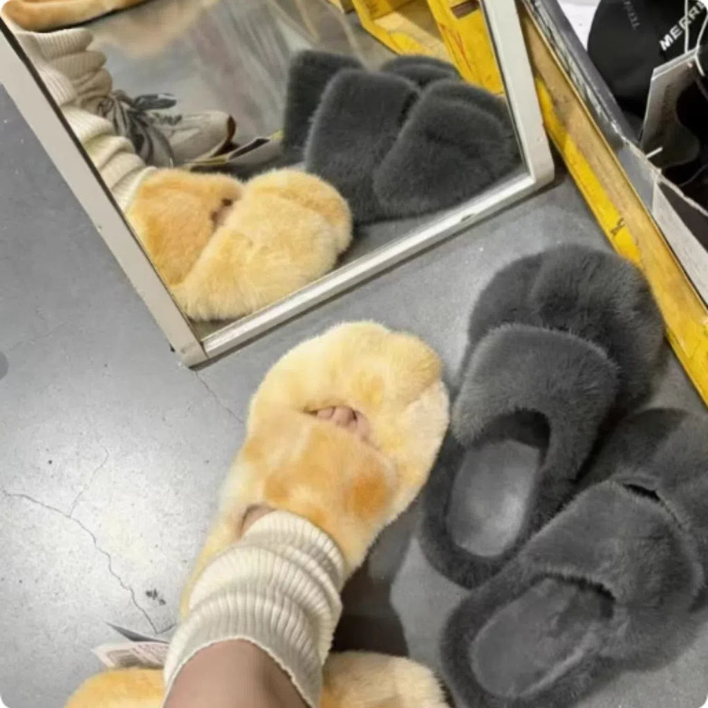 Cat paw fleece-lined slippers in yellow with non-slip sole on a floor