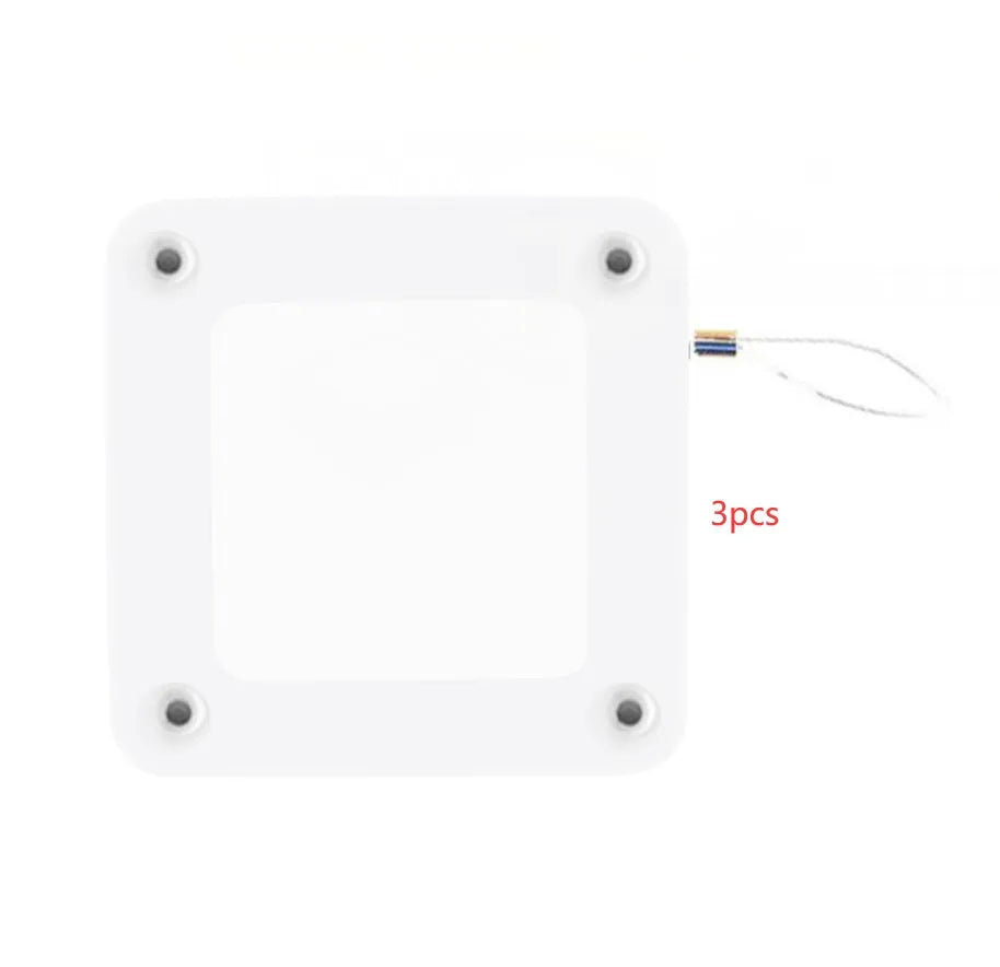 White automatic door closer with adhesive mount and tension adjuster for no-drill installation on doors.