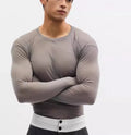 Black mesh see-through slim-fit long sleeve pullover on a hanger.