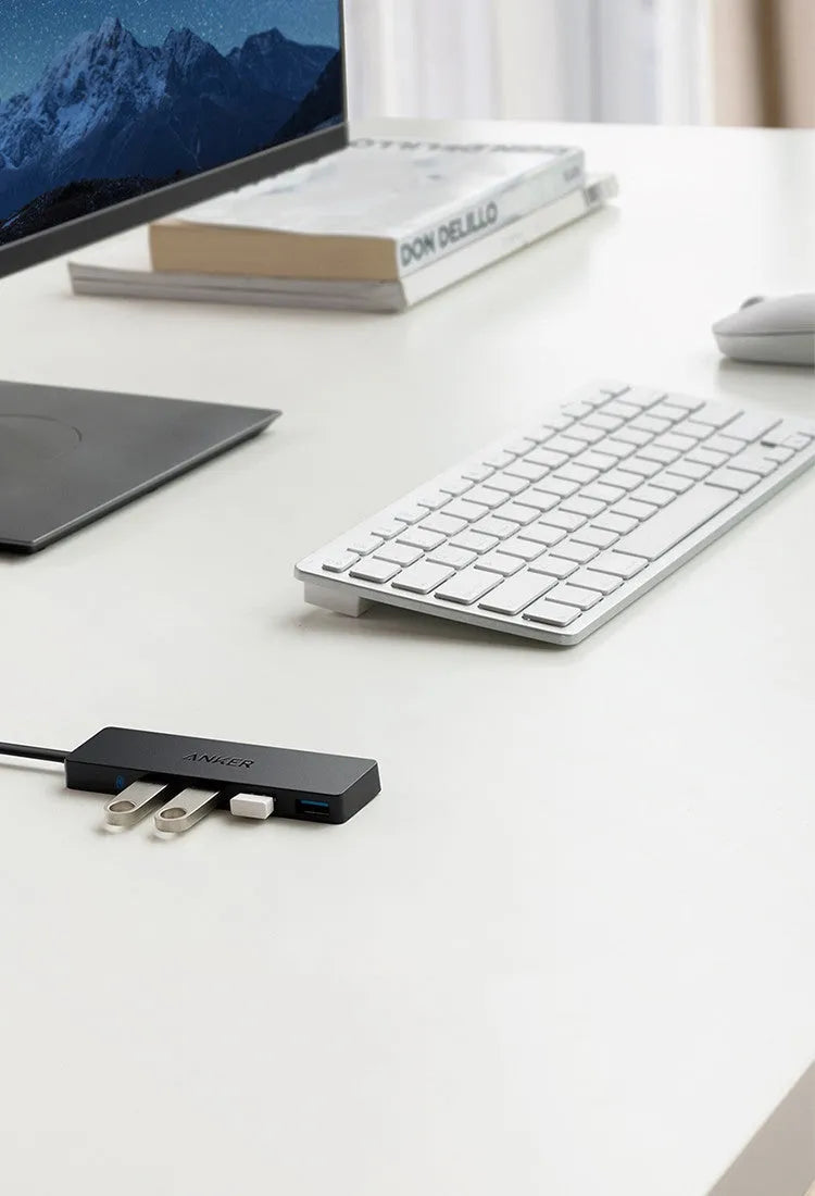 Black Anker USB 3.0 hub with four ports and 200mm cable, dimensions 30x107mm