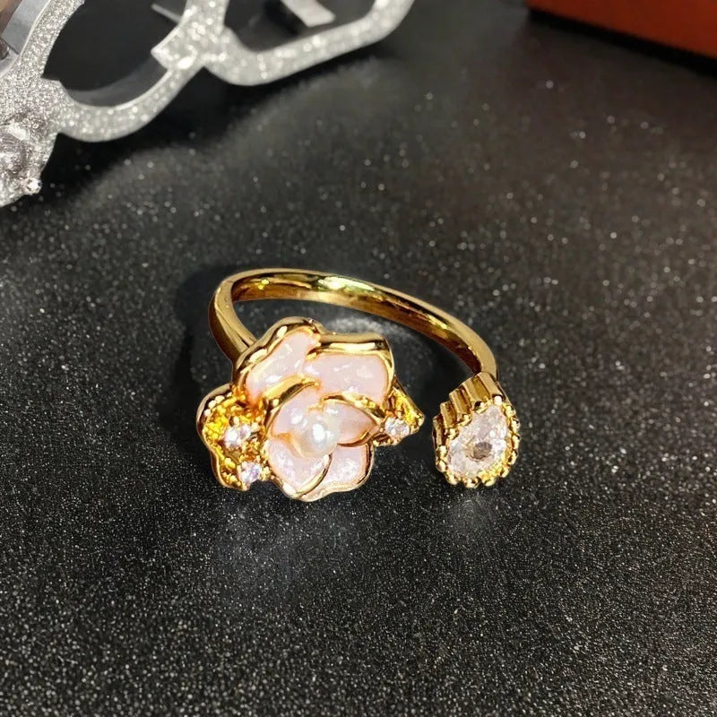 Copper adjustable vintage gourd ring with floral bow design and inlaid zircon stones.