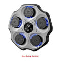 Black hanging boxing wall target with Bluetooth logo and included boxing gloves on a home wall.