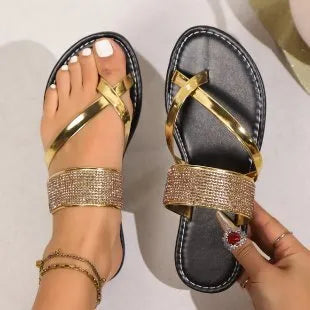 Women's black beach sandals with rhinestone toe straps and flat rubber sole