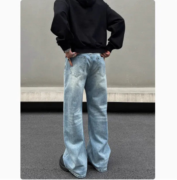 Men's blue straight jeans with whisker washing on thighs and flared leg design