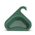 Blue plastic swan-shaped basket hanging over a kitchen sink edge to drain fruit and vegetables.