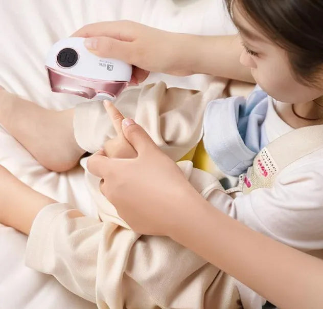 Blue electric nail clipper and polisher two-in-one tool with cleaning brush and USB cable.