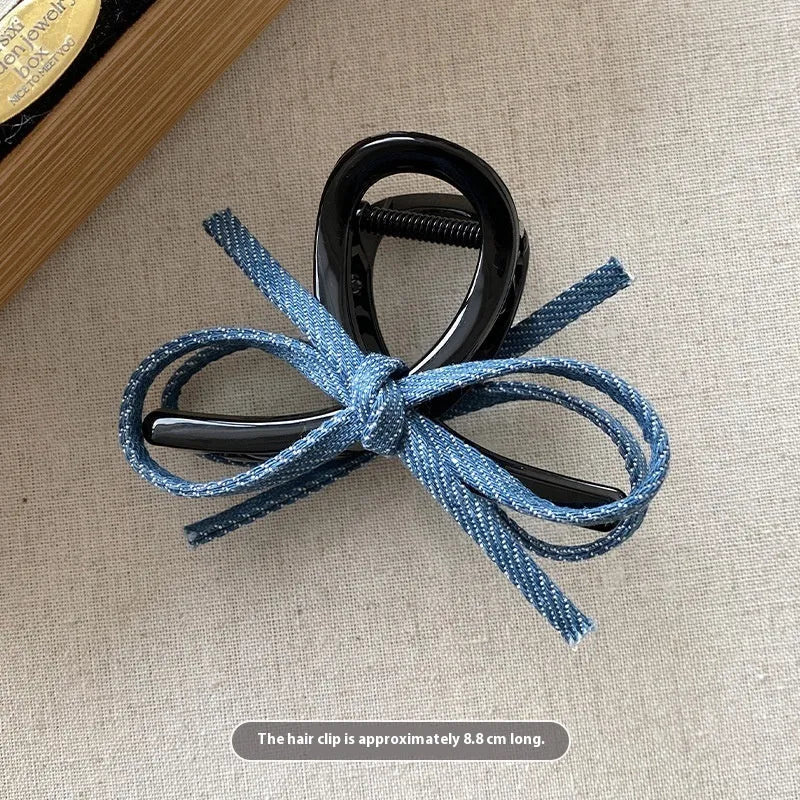 Blue denim bow barrette with cloth bow and metal clip on women back head hair