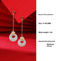 Magnolia flower Hetian jade and sterling silver necklace, bracelet, and earrings set on a white background.
