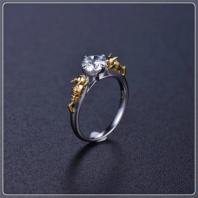 Close-up of a black gold plated crown ring on a finger, showing detailed copper modelling and a dark metallic finish.