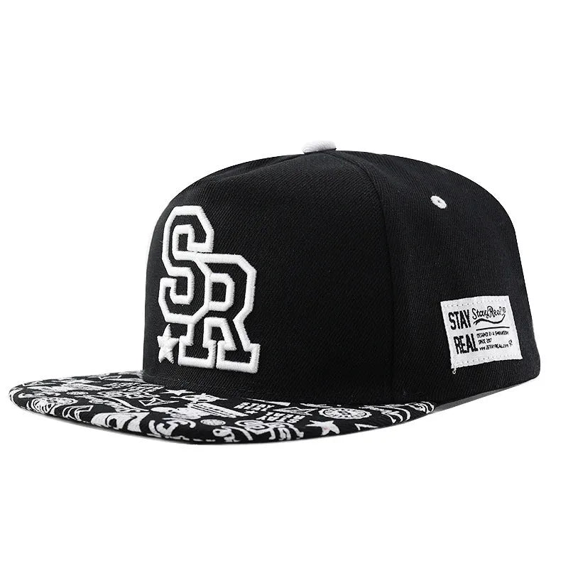 White cotton baseball cap with embroidered lettering on the front, showing the adjustable strap at the back.