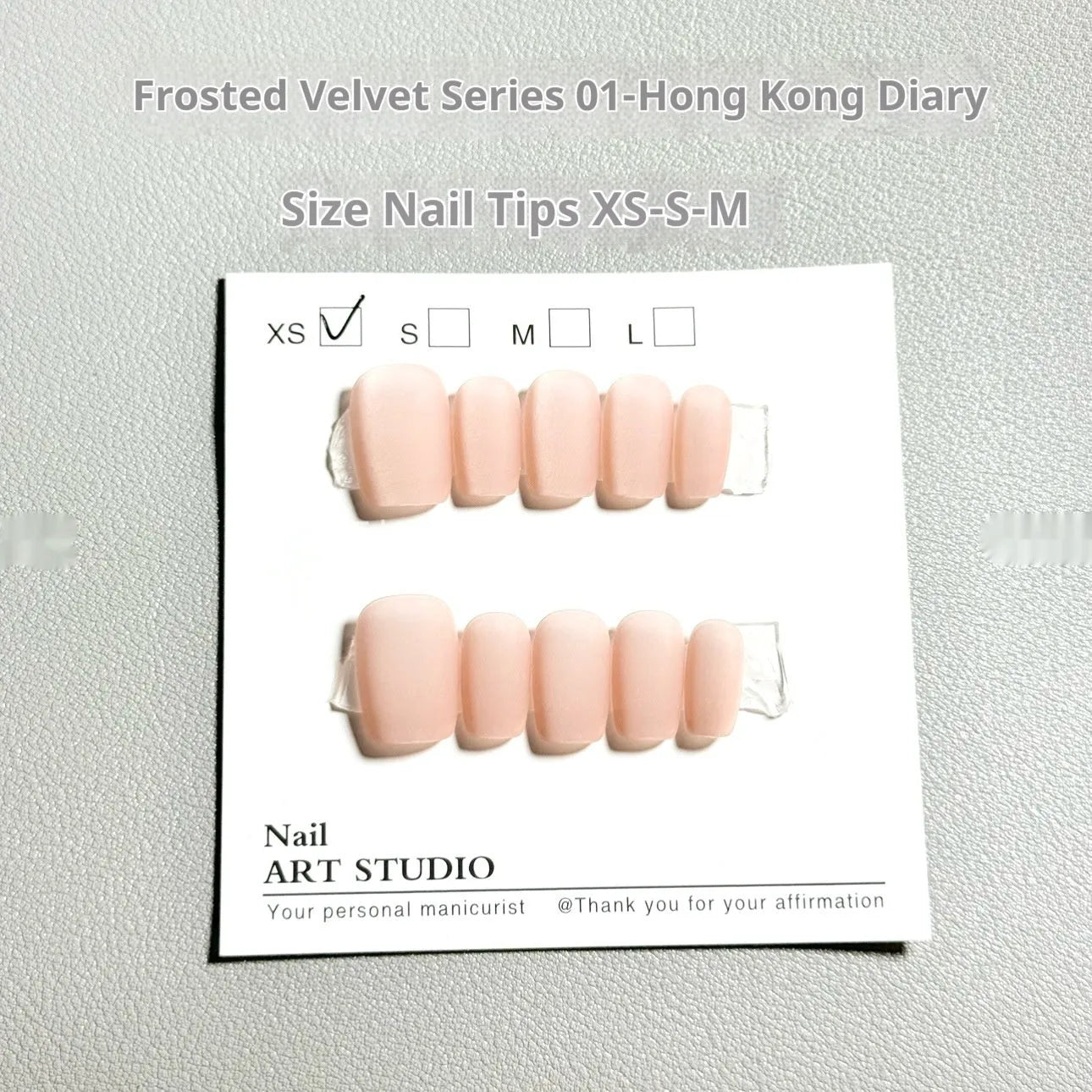 Set of frosted velvet false nails with Cat's Eye Aurora shine on a short ladder shape.