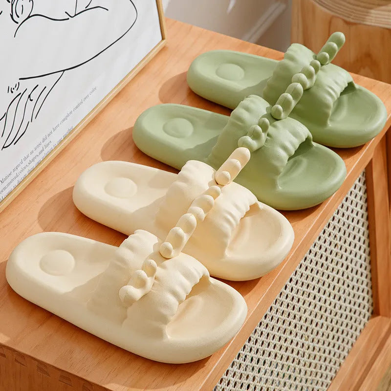 Women's hollow-out flip-flop slippers in light yellow with a textured non-slip EVA sole.
