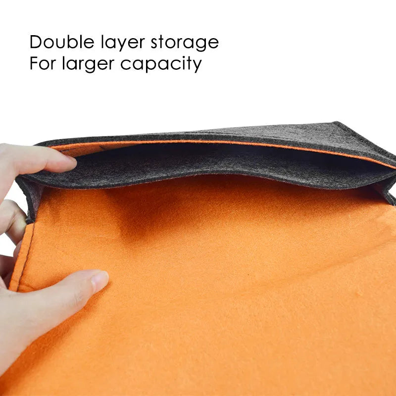 Black felt Nintendo Switch carrying pouch with game card slots and accessory compartments