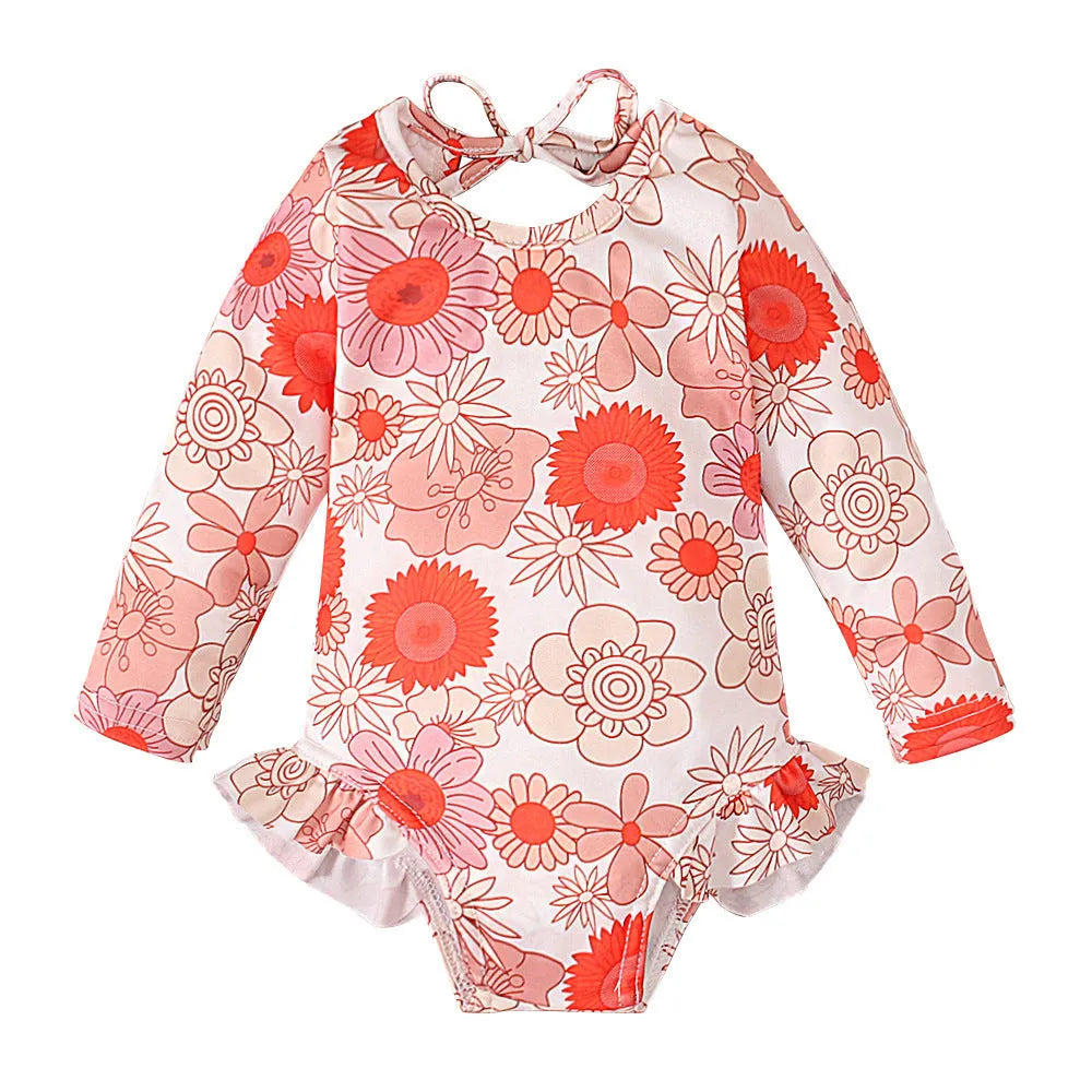 Girl's white floral print one-piece swimsuit with crew neck and open back design