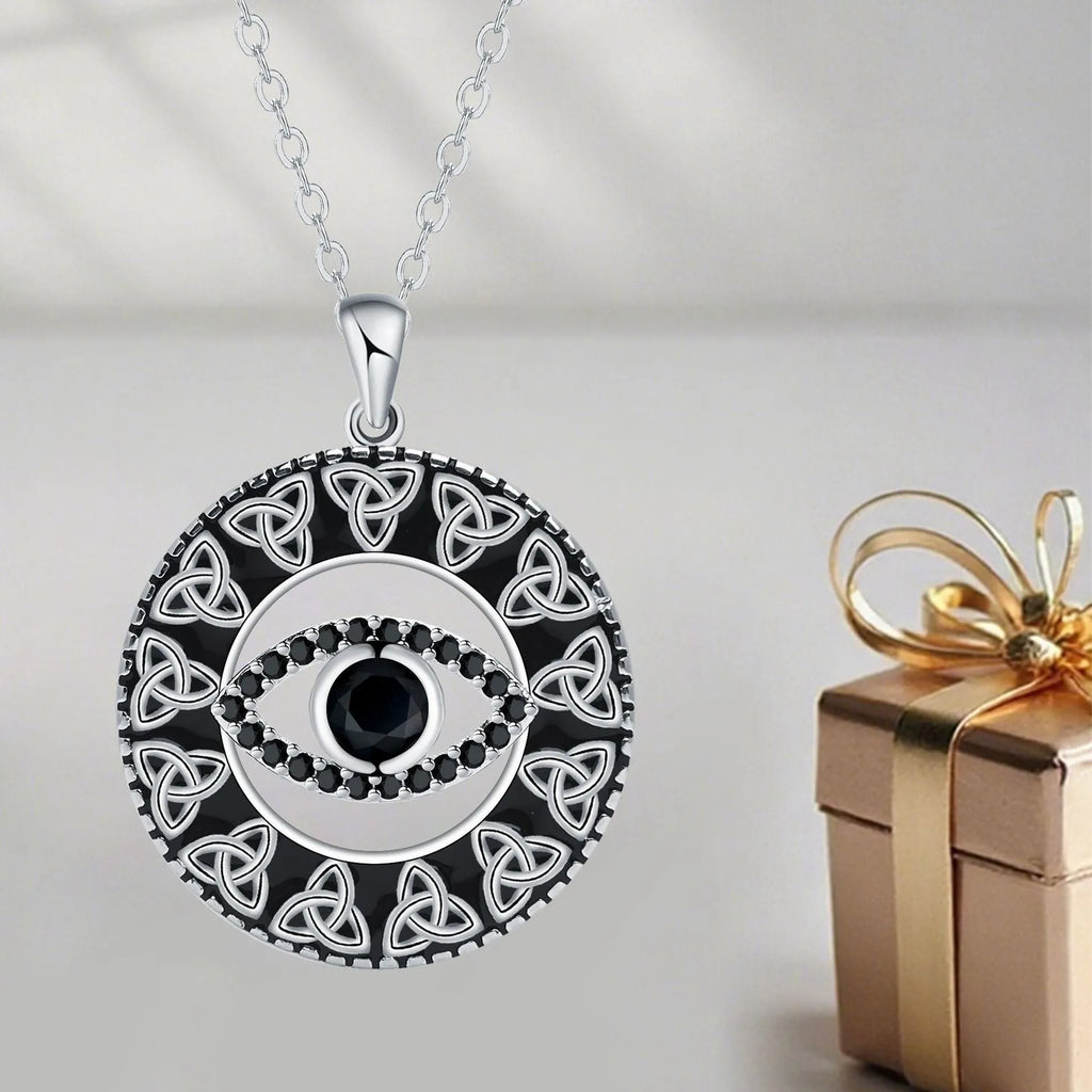 Copper Devil's Eye pendant necklace with a cross chain style on a person or mannequin.