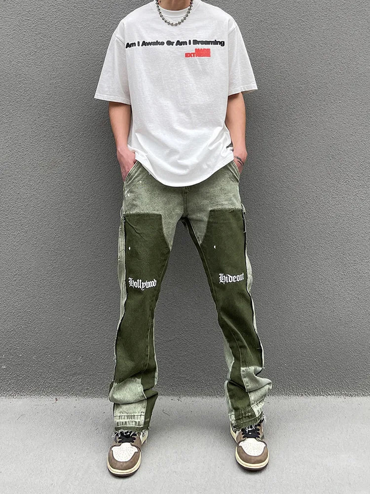 Men's heavy wash flared denim trousers in black green with multi-pocket and raw edge detailing