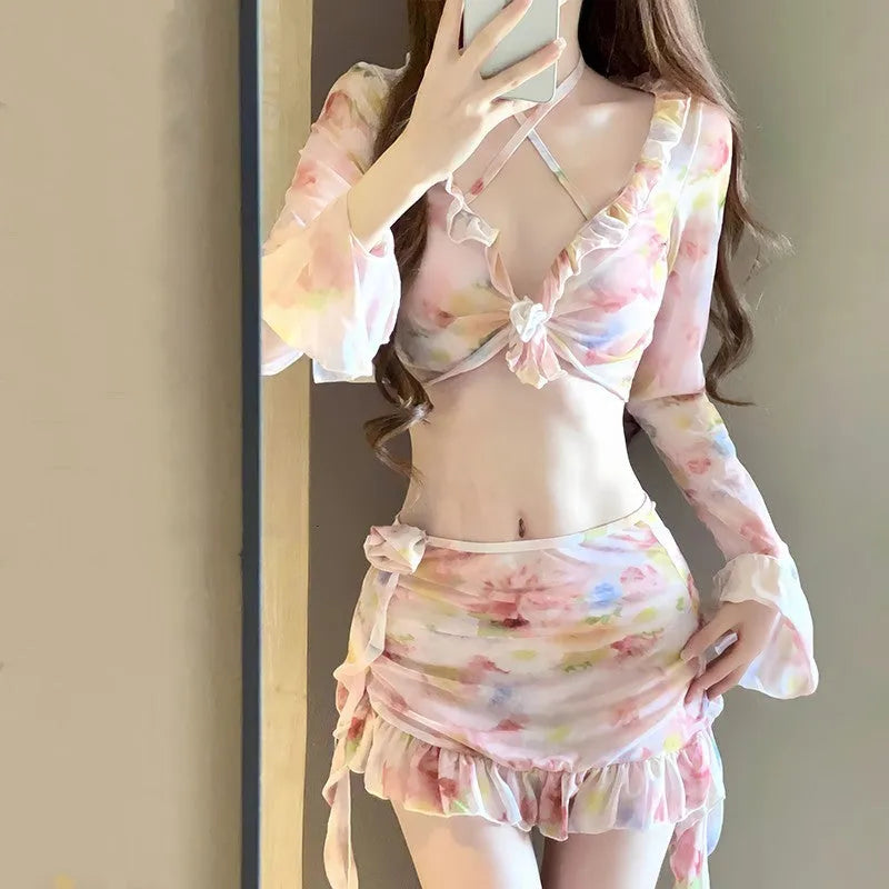 Women's cherry blossom pink floral print bikini swimsuit set on a mannequin.