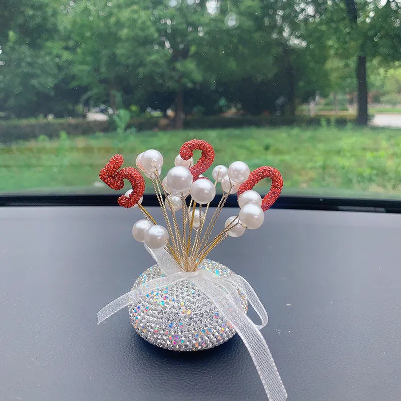 Clay star car decoration ornament for centre console in various red, pink, and pearl white colour designs.