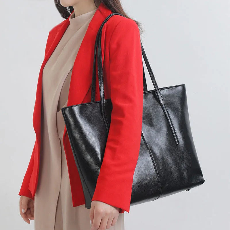 Women's genuine leather shoulder bag with retro styling and multiple internal compartments