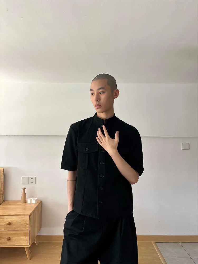 Black loose-fit half-sleeve hunting shirt with a shirt collar and handmade red eye design detail.
