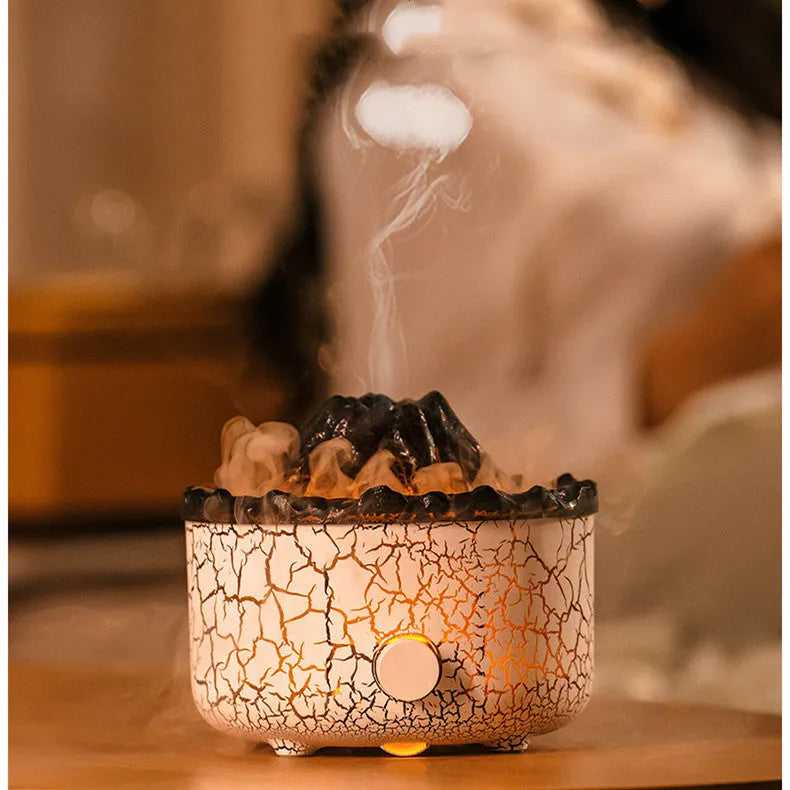 Column-shaped volcano humidifier diffuser emitting mist with red and orange LED flame effect
