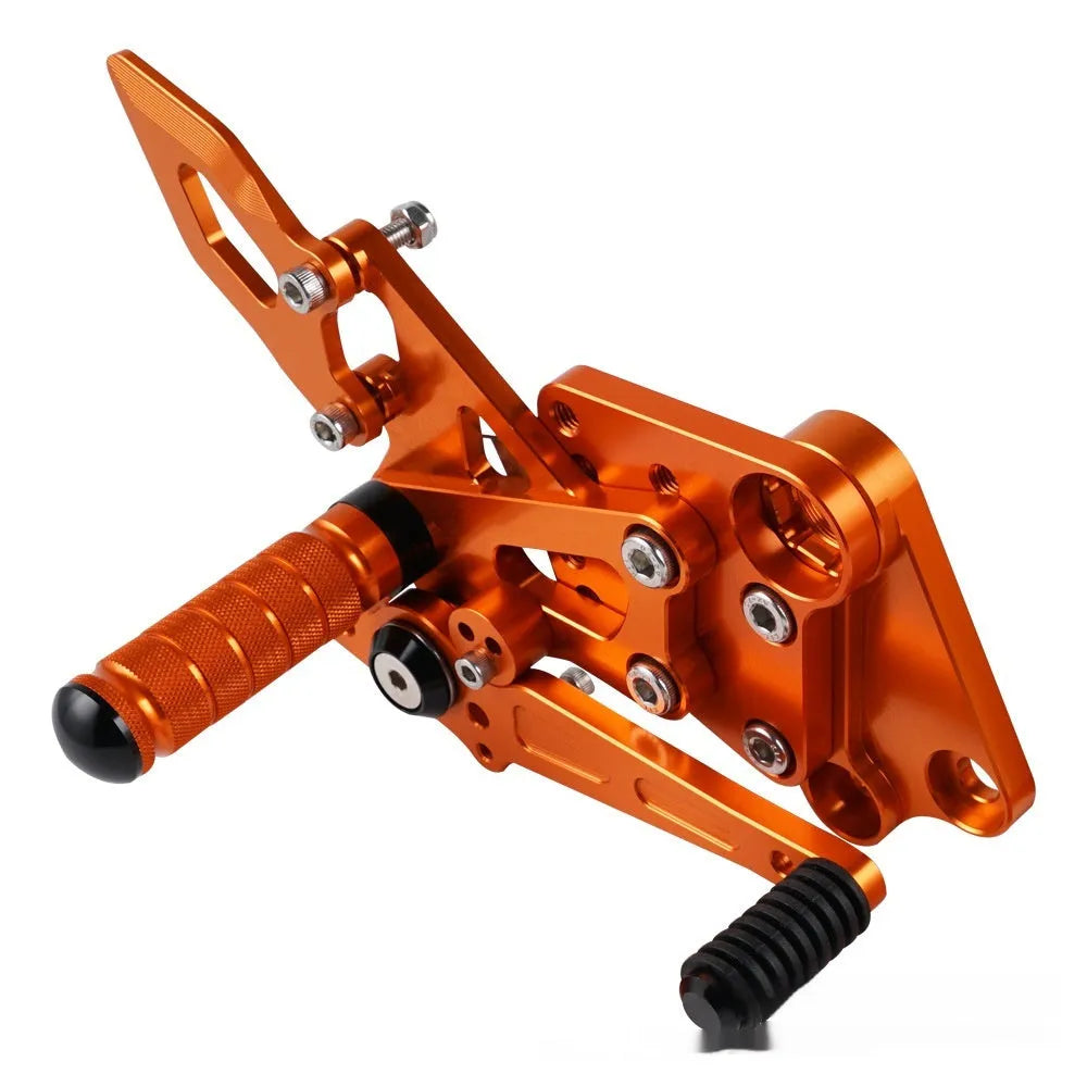 KTM Duke motorcycle black and orange foot pedal support assembly modification kit