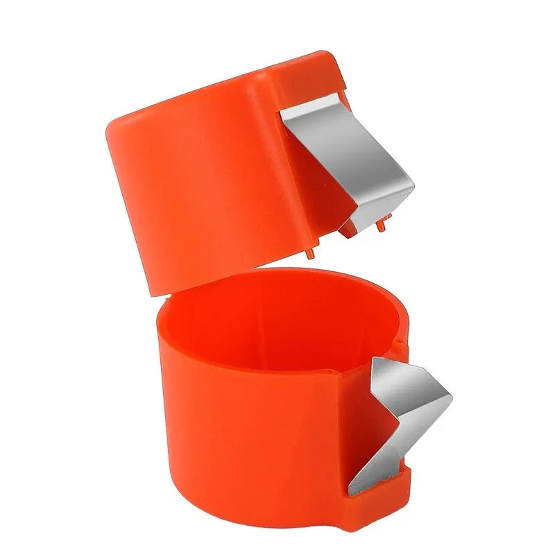 Colourful egg shell opener and beater kitchen tool made of stainless steel and plastic on a kitchen counter.