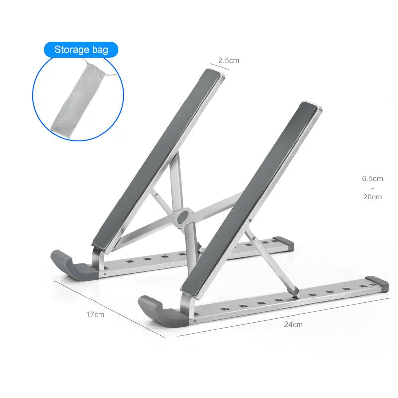 Folding aluminium laptop stand in silver, open and holding a laptop, with non-slip silicone pads visible