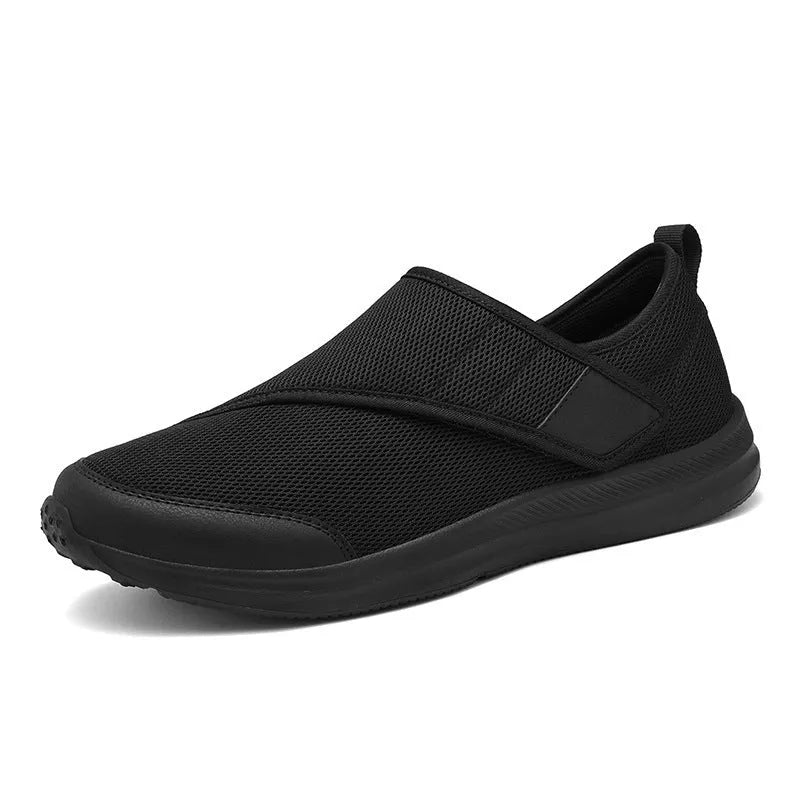 A pair of casual walking shoes with a mesh upper and Velcro strap closure, shown in one of four available colours.