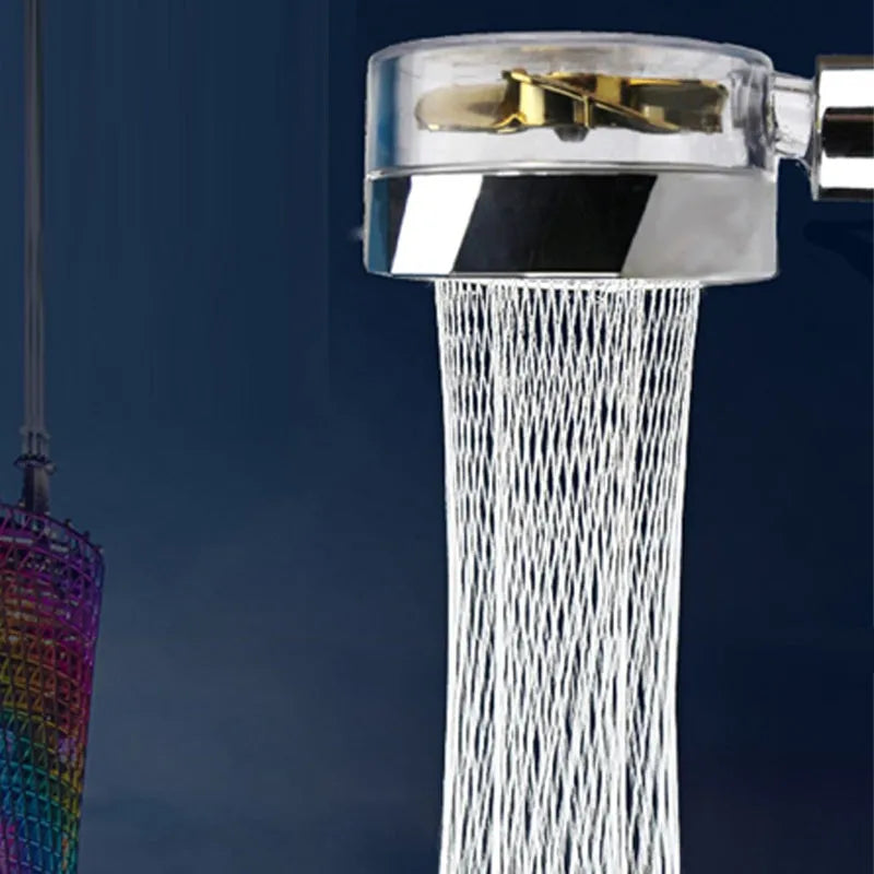 Blue handheld shower head with stop button and turbo nozzle on a chrome bracket.