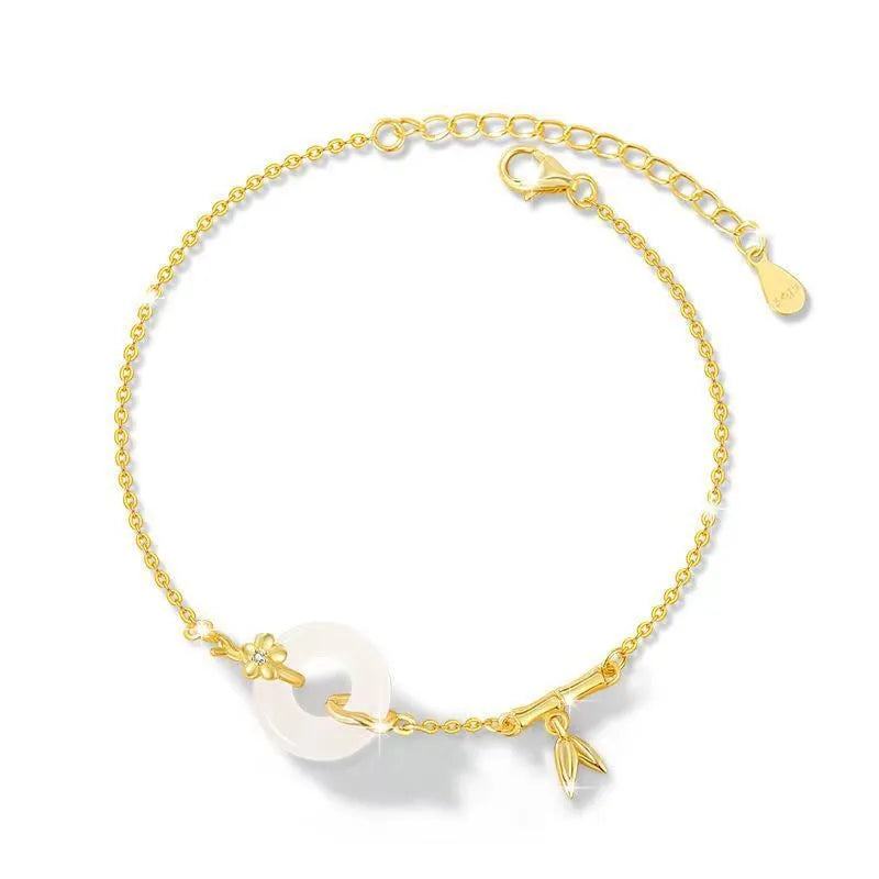 Silver bracelet with white chalcedony stone and starry sky patterned gold peace buckle.