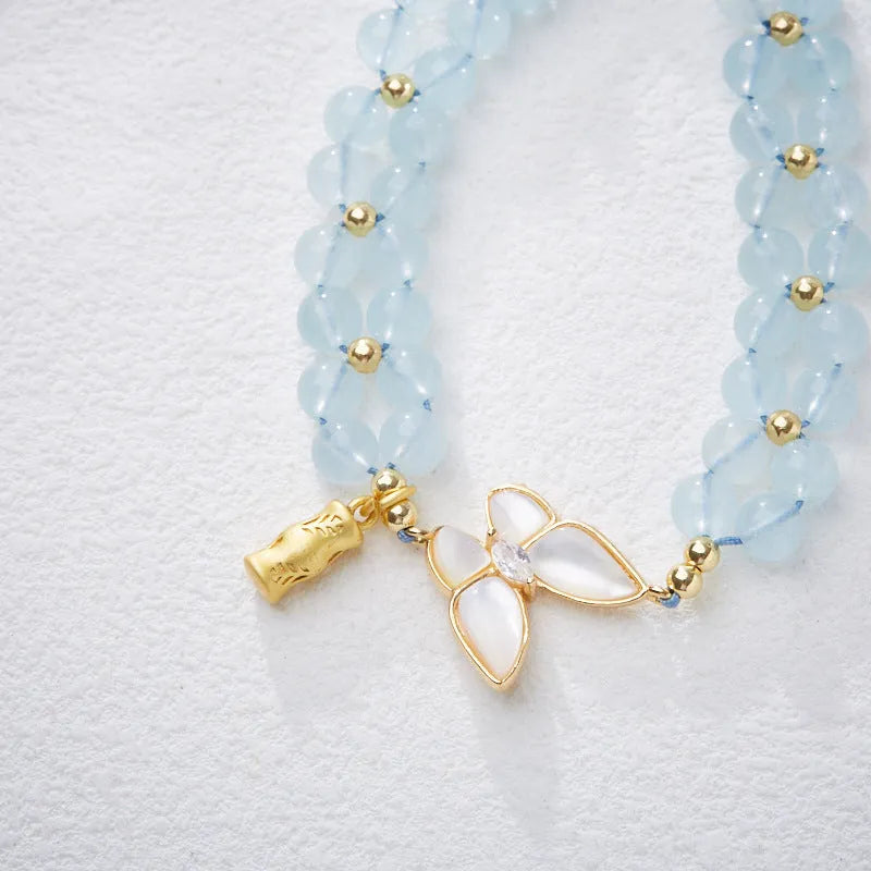 Handmade women's woven bracelet with butterfly design in aquamarine, amethyst or moonstone gemstones