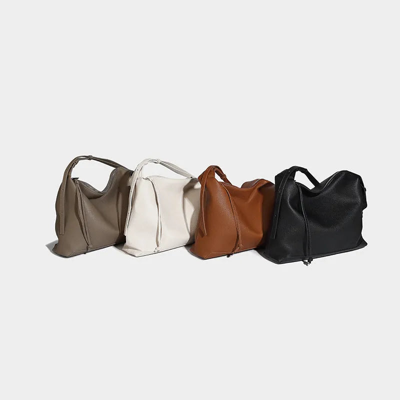 Large caramel coloured PU messenger bag with shoulder strap showing 36cm length