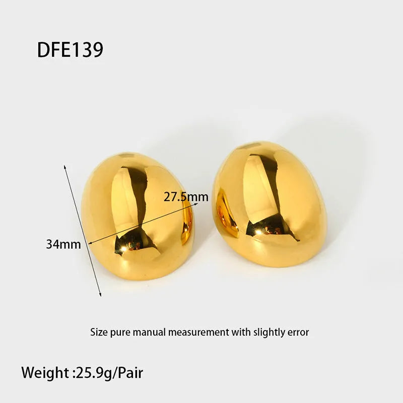 Geometric stainless steel ear studs with 18K gold plating and a glazed surface finish.