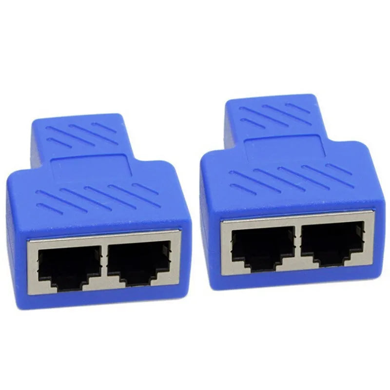 White RJ45 three-way tee network cable splitter adapter on a table.